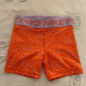 Orange cheetah print Nike pros
